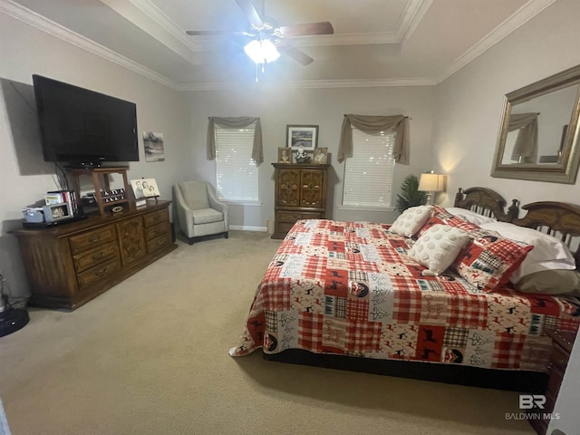 bedroom with light colored carpet, a raised ceiling, ceiling fan, and crown molding