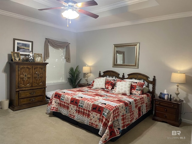 carpeted bedroom with ceiling fan and ornamental molding