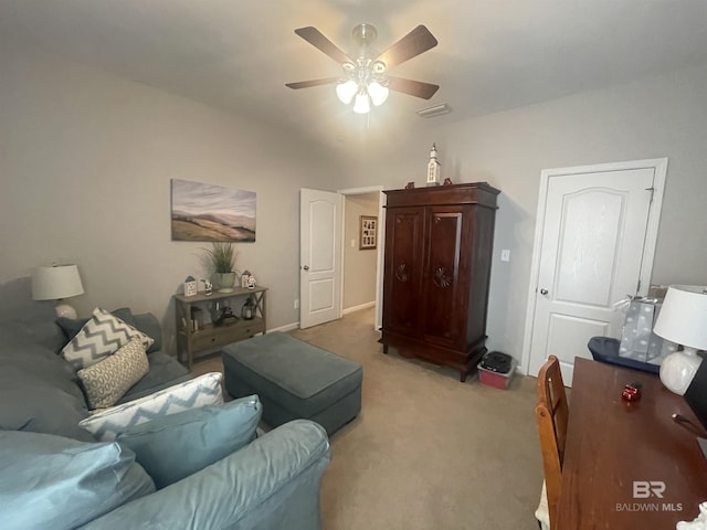 carpeted living room with ceiling fan