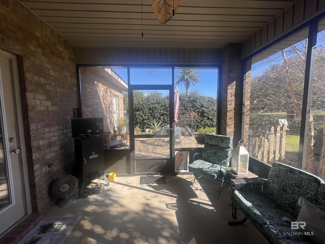 sunroom with wooden ceiling