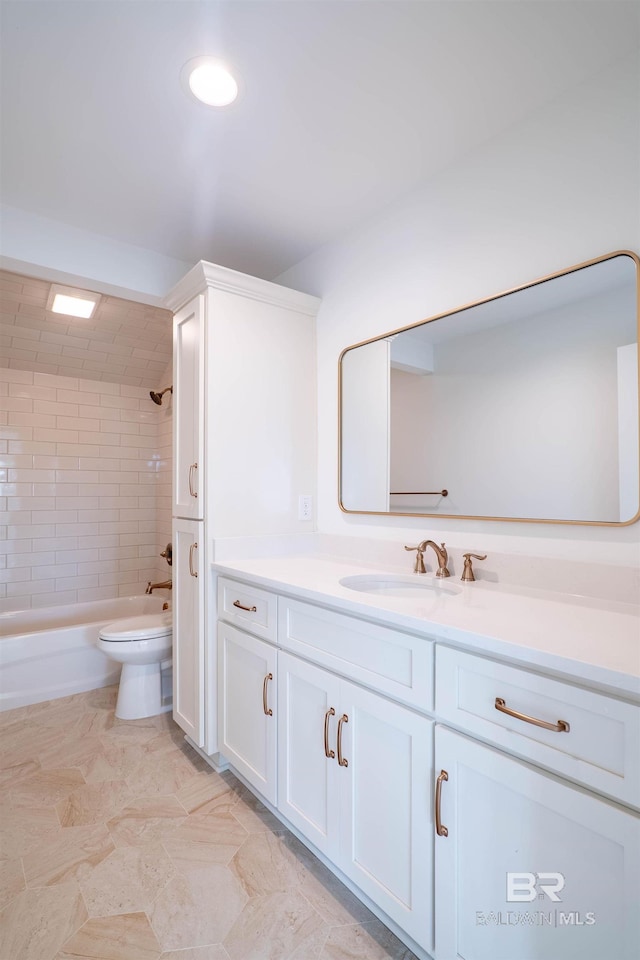 full bathroom featuring vanity, toilet, and tiled shower / bath combo