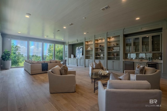 living room featuring expansive windows, beverage cooler, wooden ceiling, bar area, and light hardwood / wood-style floors