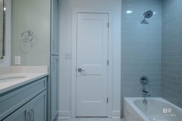 bathroom featuring vanity and tiled shower / bath combo