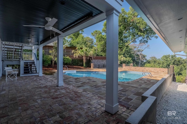 view of swimming pool with a patio area and ceiling fan