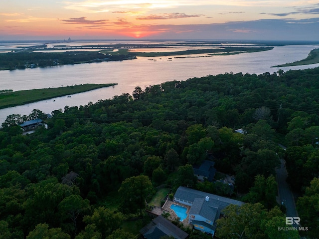 aerial view at dusk with a water view