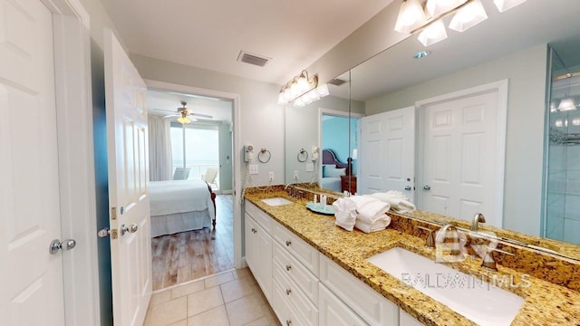 375 Beach Club Trl Unit A-1608, Gulf Shores, AL 36542 - full bathroom featuring ensuite bath, double vanity, tile patterned flooring, and a ceiling fan