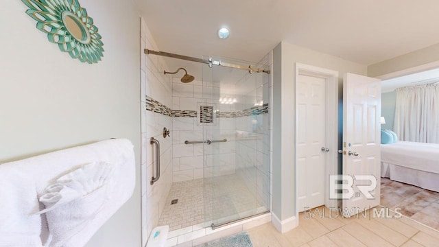 375 Beach Club Trl Unit A-1608, Gulf Shores, AL 36542 - full bathroom featuring connected bathroom, a shower stall, and tile patterned flooring