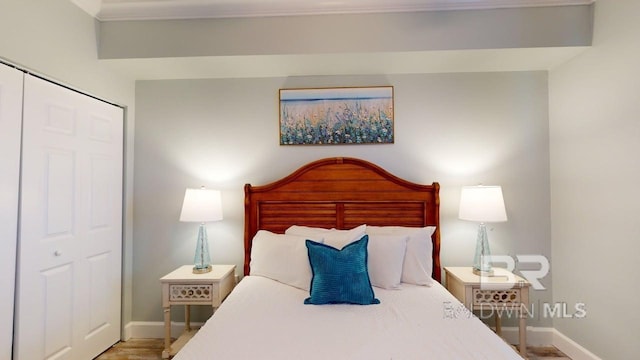 375 Beach Club Trl Unit A-1608, Gulf Shores, AL 36542 - bedroom with baseboards and wood finished floors