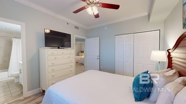 375 Beach Club Trl Unit A-1608, Gulf Shores, AL 36542 - bedroom with a closet, crown molding, light wood-type flooring, baseboards, and connected bathroom