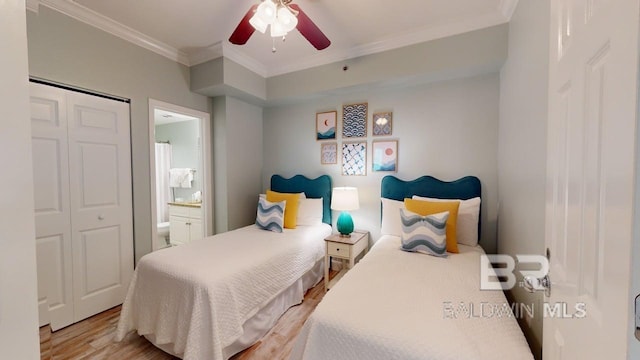 375 Beach Club Trl Unit A-1608, Gulf Shores, AL 36542 - bedroom with ornamental molding, light wood-style flooring, ceiling fan, and connected bathroom