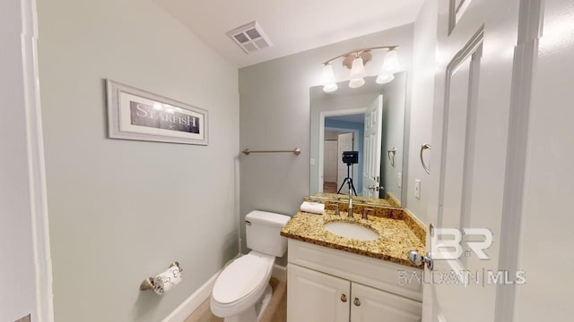 375 Beach Club Trl Unit A-1608, Gulf Shores, AL 36542 - half bathroom with toilet, vanity, and baseboards
