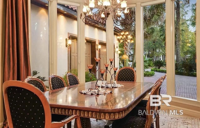 dining space with a chandelier