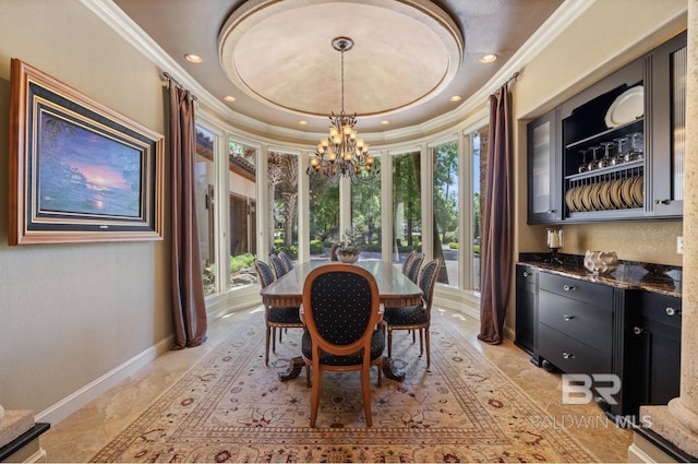 dining area featuring an inviting chandelier and ornamental molding