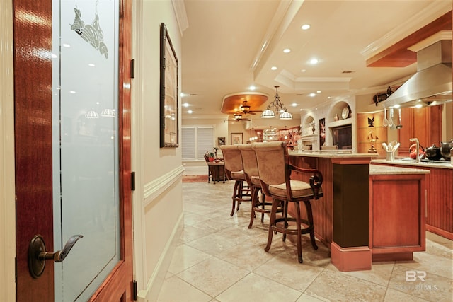 bar featuring light tile patterned flooring, crown molding, island range hood, decorative light fixtures, and light stone countertops