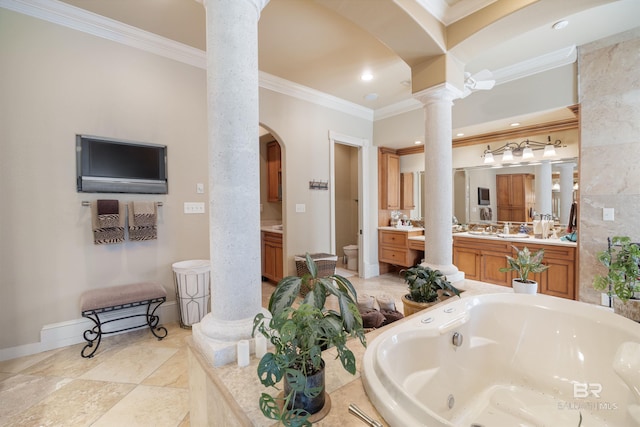 bathroom featuring ornate columns, a tub to relax in, vanity, toilet, and crown molding