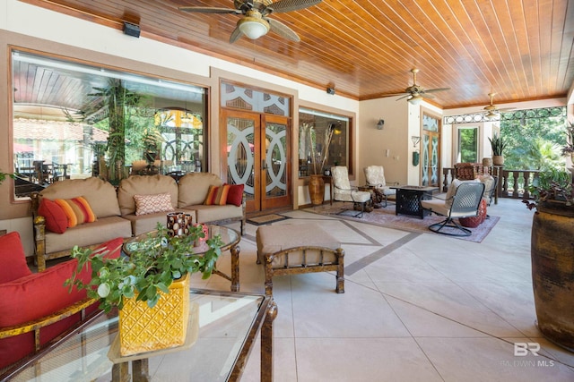 sunroom with wood ceiling, ceiling fan, and french doors