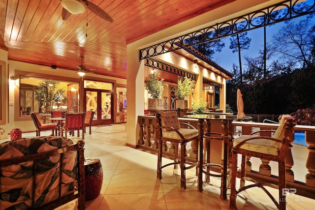 exterior space featuring ceiling fan, wood ceiling, and french doors