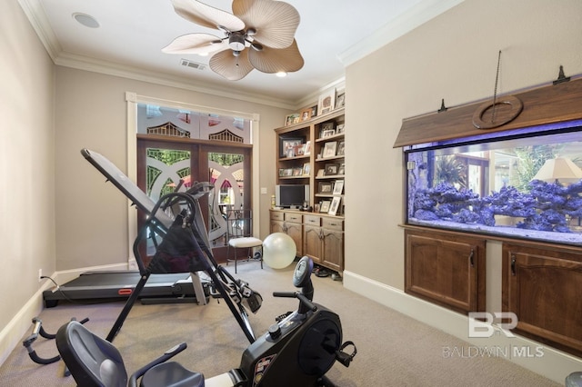 exercise area with crown molding, light carpet, ceiling fan, and french doors