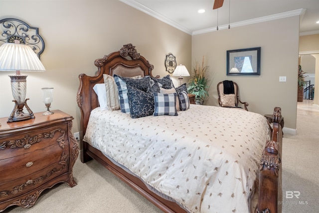 carpeted bedroom featuring ornamental molding and ceiling fan