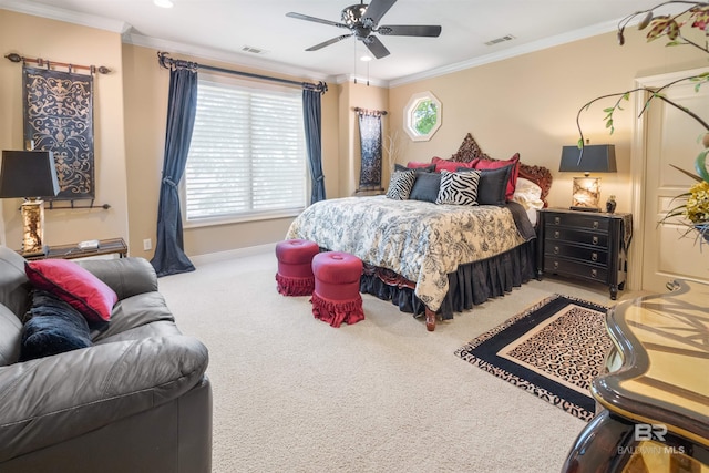 bedroom with ornamental molding, light colored carpet, and ceiling fan