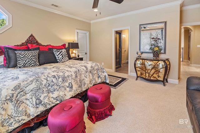 bedroom with crown molding, ceiling fan, and light carpet