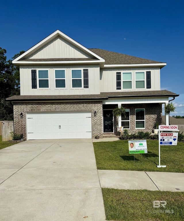 31743 Memphis Loop, Spanish Fort, AL 36527 - view of front of house featuring a garage, brick siding, and concrete driveway