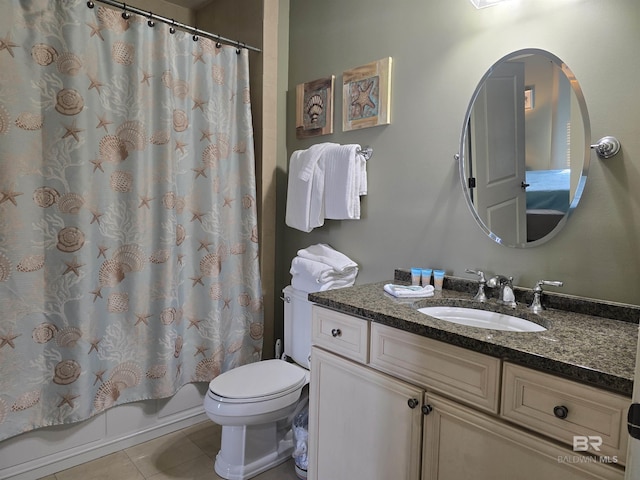 full bathroom featuring vanity, toilet, tile patterned floors, and shower / bath combo with shower curtain