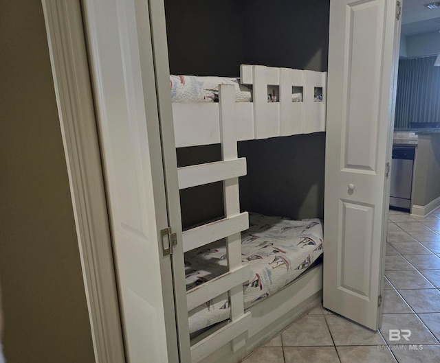 bedroom featuring light tile patterned floors