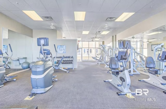 workout area featuring a paneled ceiling