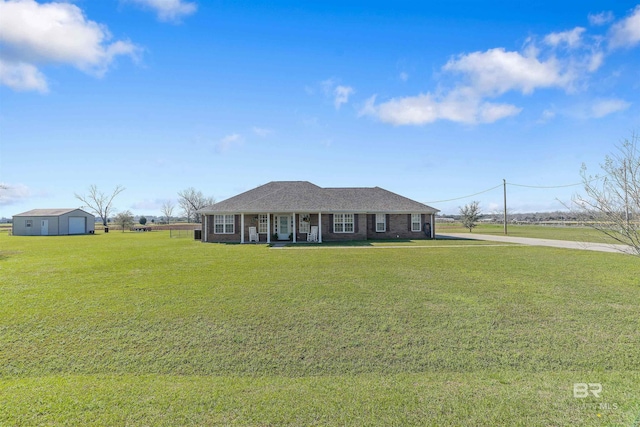 17570 Driskell Rd, Loxley, AL 36551 - ranch-style home featuring covered porch, a front yard, and brick siding