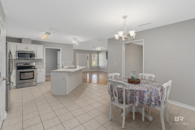 17570 Driskell Rd, Loxley, AL 36551 - dining area with a chandelier, light tile patterned flooring, and ceiling fan