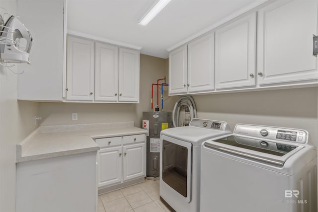 17570 Driskell Rd, Loxley, AL 36551 - laundry room featuring water heater, washer and dryer, cabinet space, and light tile patterned floors