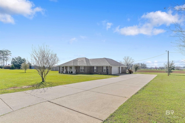 17570 Driskell Rd, Loxley, AL 36551 - ranch-style house with an attached garage, a front yard, and driveway