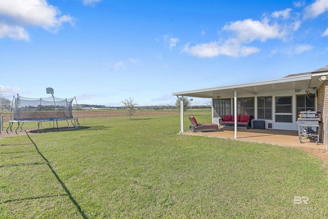 17570 Driskell Rd, Loxley, AL 36551 - view of yard with a trampoline, a patio, and an outdoor living space