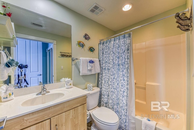 521 W Beach Blvd Unit 2102, Gulf Shores, AL 36542 - bathroom featuring vanity, toilet, shower / tub combo, and recessed lighting