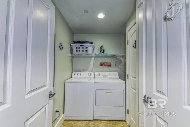 521 W Beach Blvd Unit 2102, Gulf Shores, AL 36542 - washroom featuring independent washer and dryer, baseboards, and recessed lighting