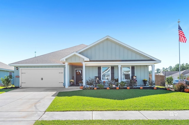 22310 Early Dawn Cir, Foley, AL 36535 - craftsman house featuring board and batten siding, roof with shingles, a front yard, a garage, and concrete driveway