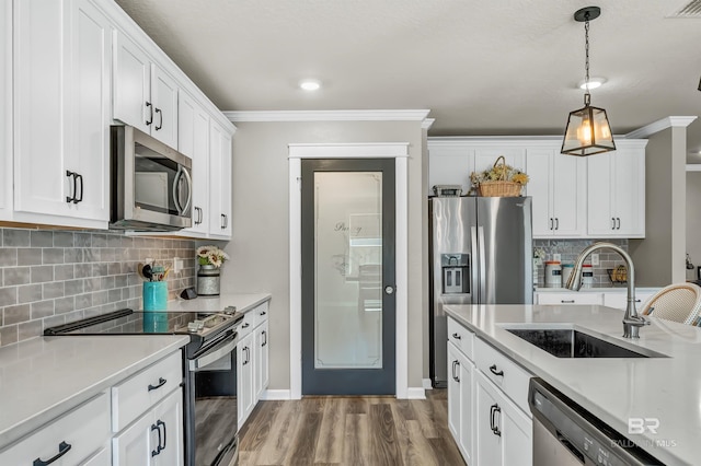 22310 Early Dawn Cir, Foley, AL 36535 - kitchen with a sink, appliances with stainless steel finishes, ornamental molding, and light countertops