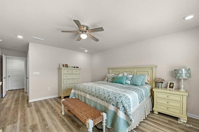 22310 Early Dawn Cir, Foley, AL 36535 - bedroom with baseboards, light wood finished floors, and visible vents