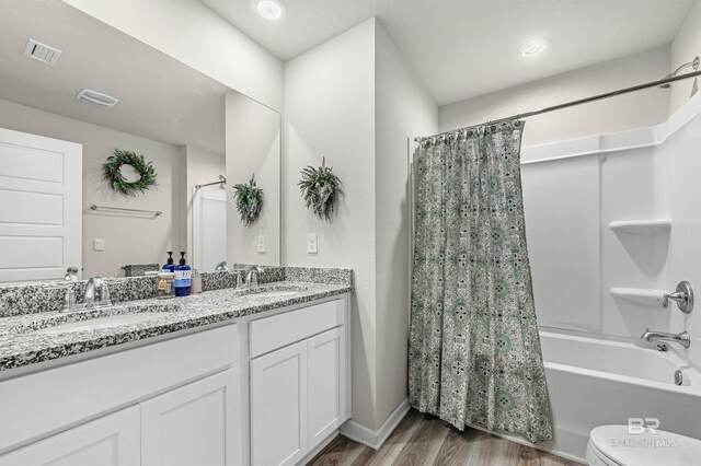 22310 Early Dawn Cir, Foley, AL 36535 - bathroom with a sink, toilet, wood finished floors, and visible vents