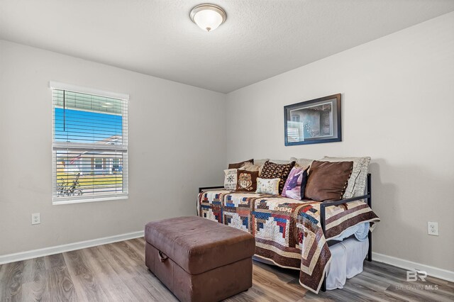 22310 Early Dawn Cir, Foley, AL 36535 - bedroom with baseboards and wood finished floors