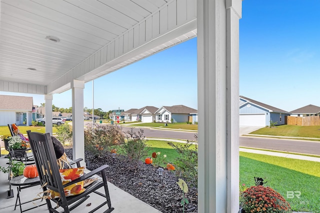 22310 Early Dawn Cir, Foley, AL 36535 - view of patio featuring covered porch and a residential view