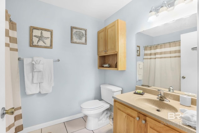 bathroom featuring a shower with shower curtain, toilet, vanity, tile patterned flooring, and baseboards