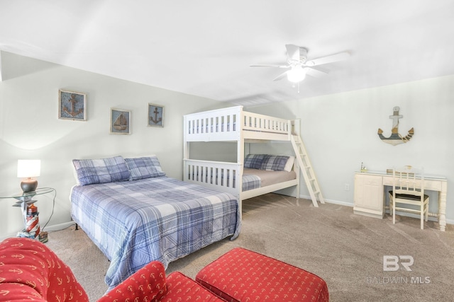 carpeted bedroom featuring a ceiling fan and baseboards