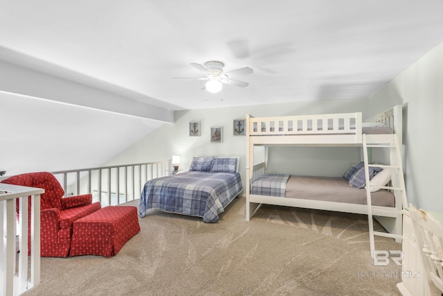 bedroom featuring carpet floors, vaulted ceiling, and ceiling fan