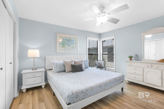 bedroom featuring a closet, a ceiling fan, and light wood-style floors