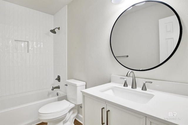 bathroom with toilet, bathing tub / shower combination, and vanity