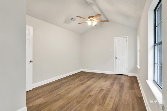 unfurnished room with ceiling fan, wood finished floors, and baseboards