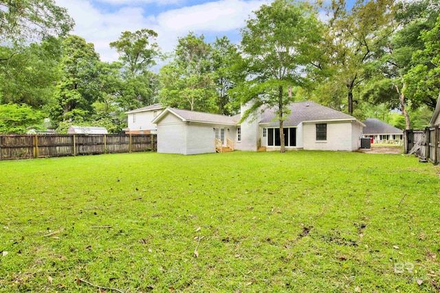 rear view of house featuring view of scattered trees