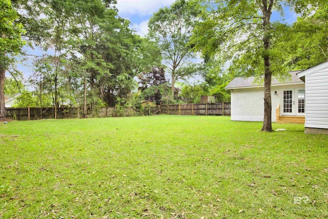 view of yard with french doors
